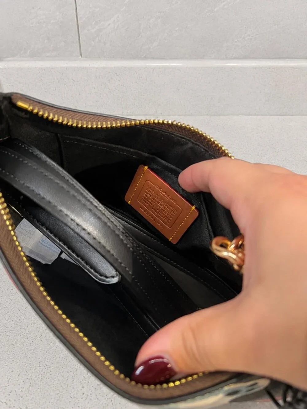 Coach features signature